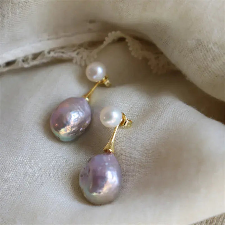 Elegantiški auskarai su violetiniu perlu