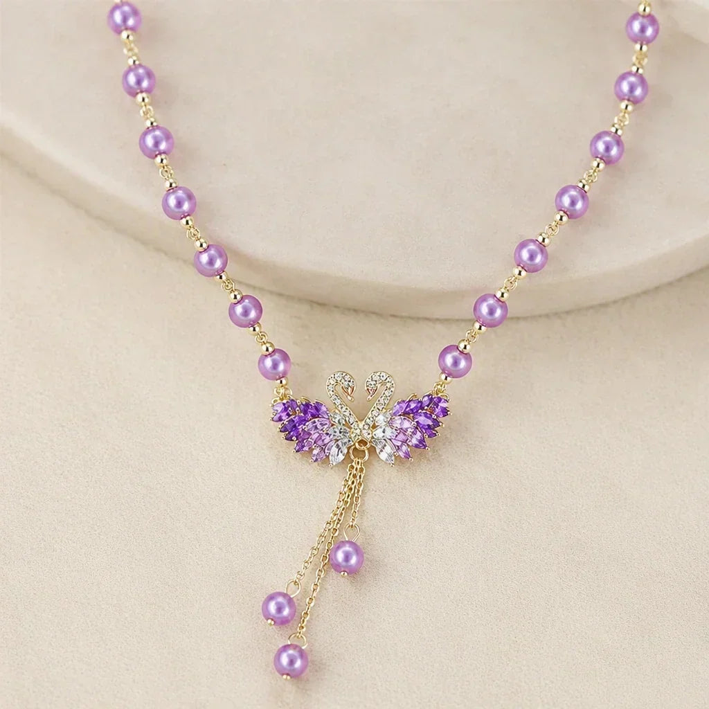 Ikoniškas vėrinys su violetine gulbe